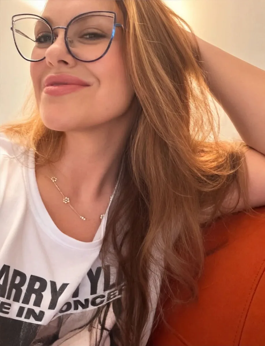 Kristin in her cat-eye glasses